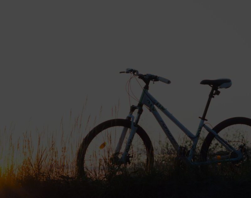 Silhouette of a bicycle at sunset symbolising the Free Bikes 4 Kids project, helping children access bikes for free.